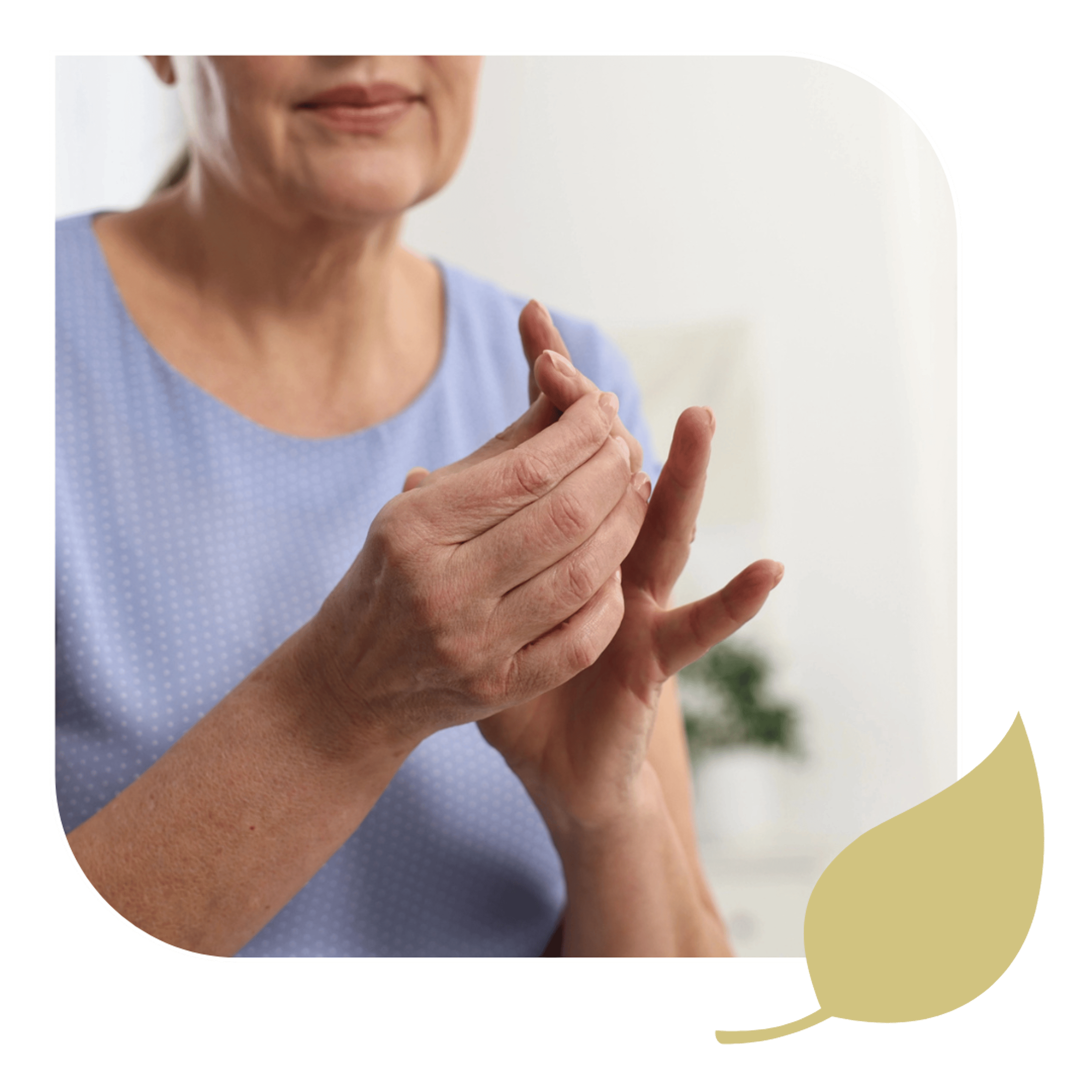 An elderly woman cradles her aching, arthritic fingers in Stuart, FL.