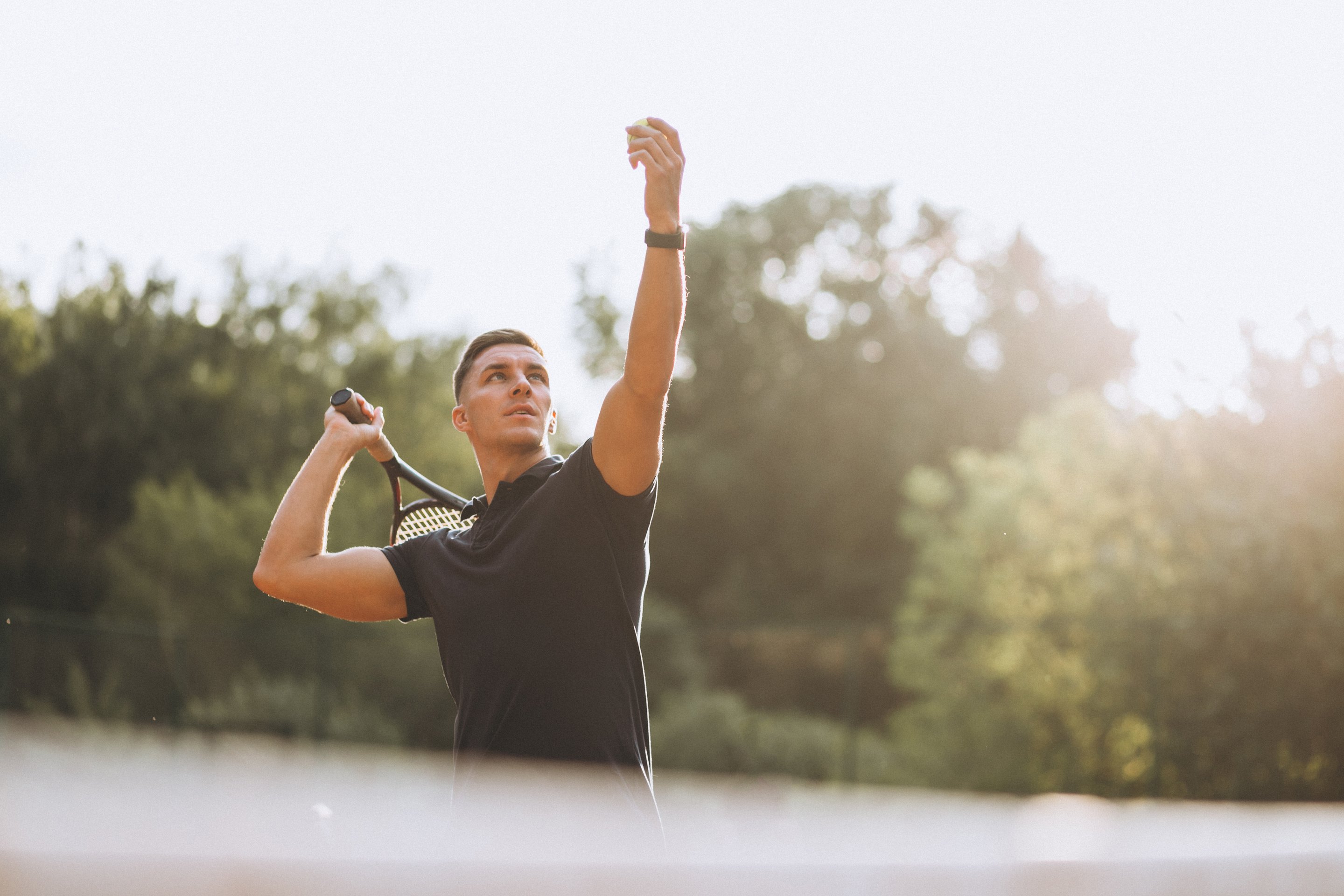 A healthy young man playing tennis after nutritional counseling.