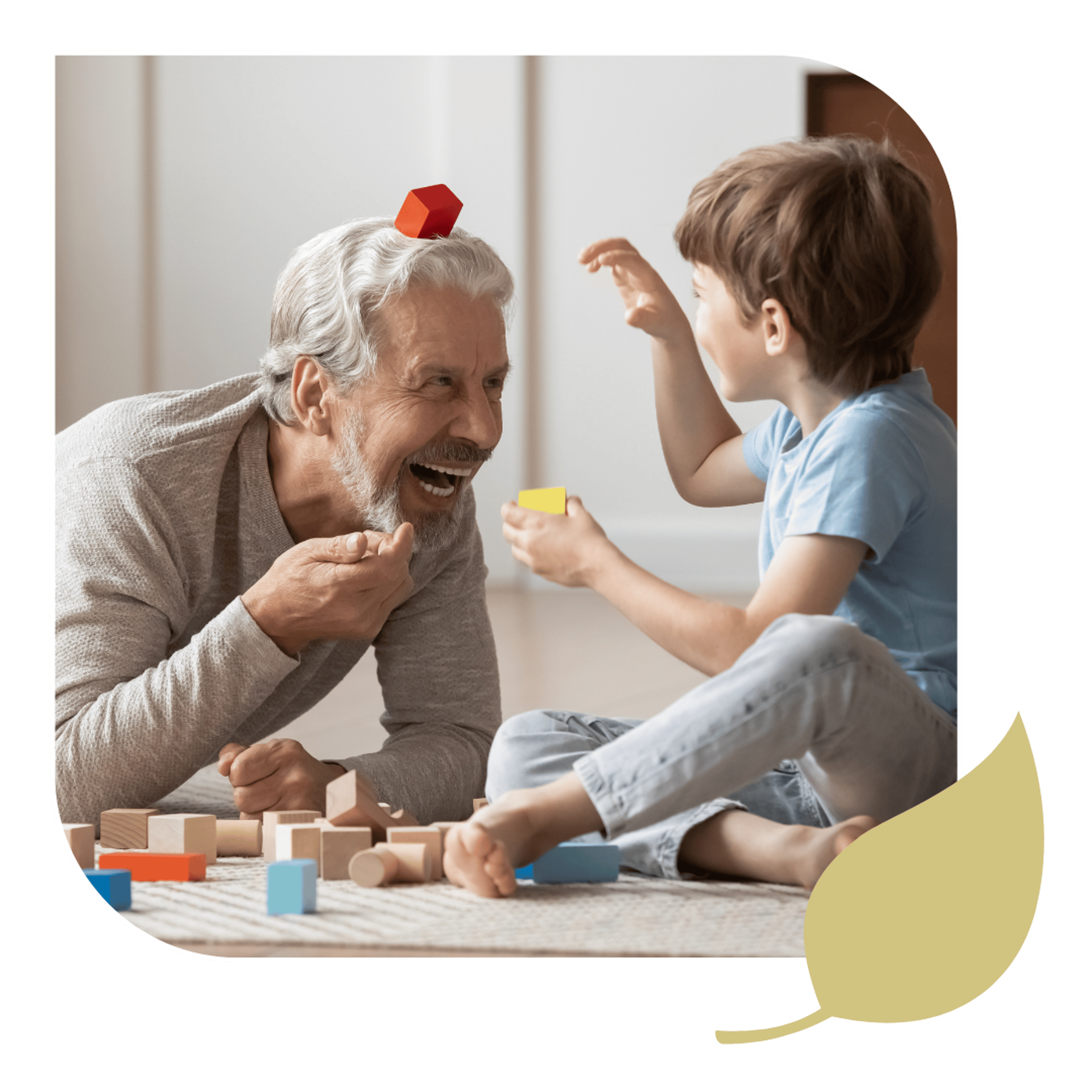 A healthy elderly man playing with grandchild after chiropractic treatment.