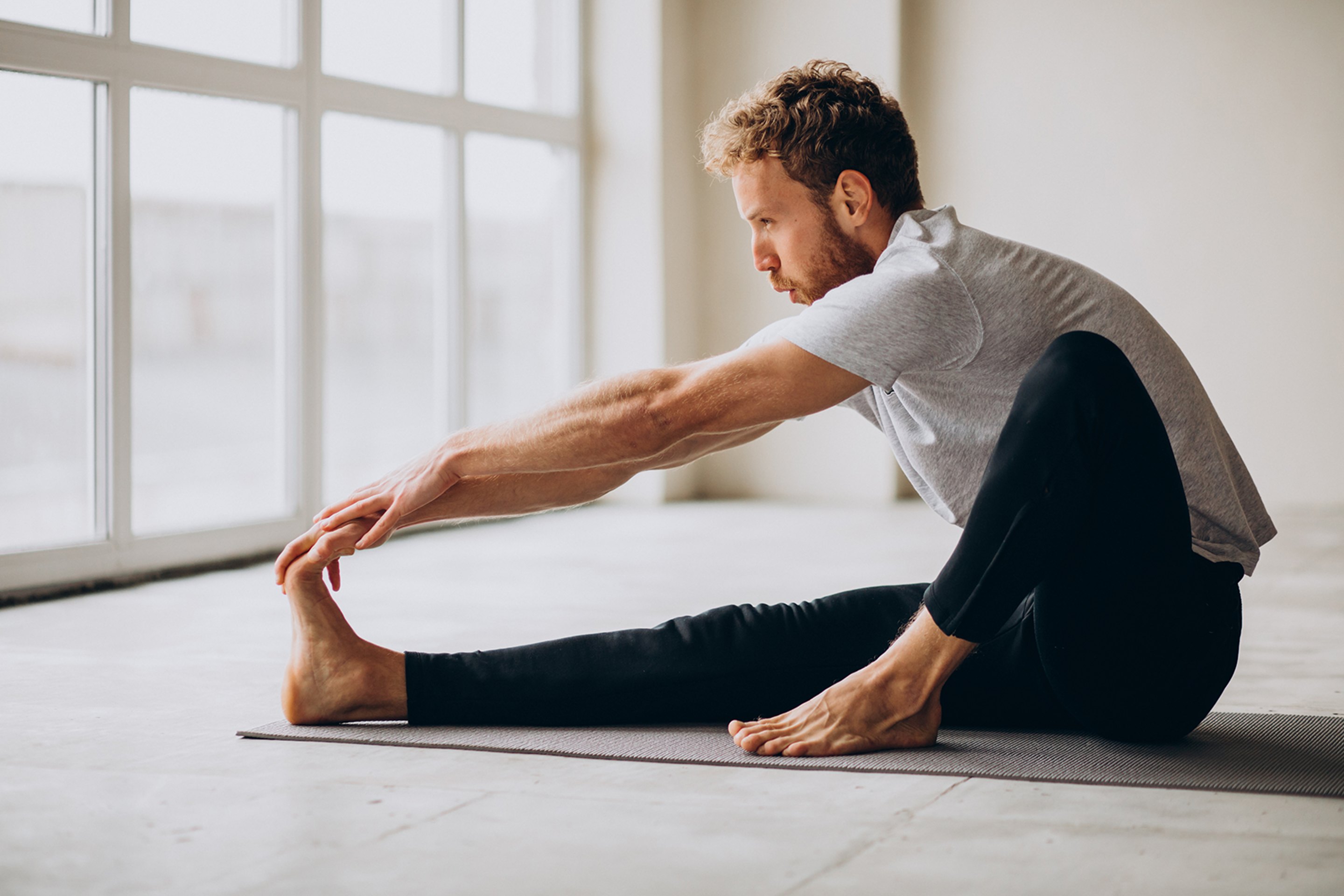 A man stretching his leg after Platelet Rich Plasma Injection Therapy.