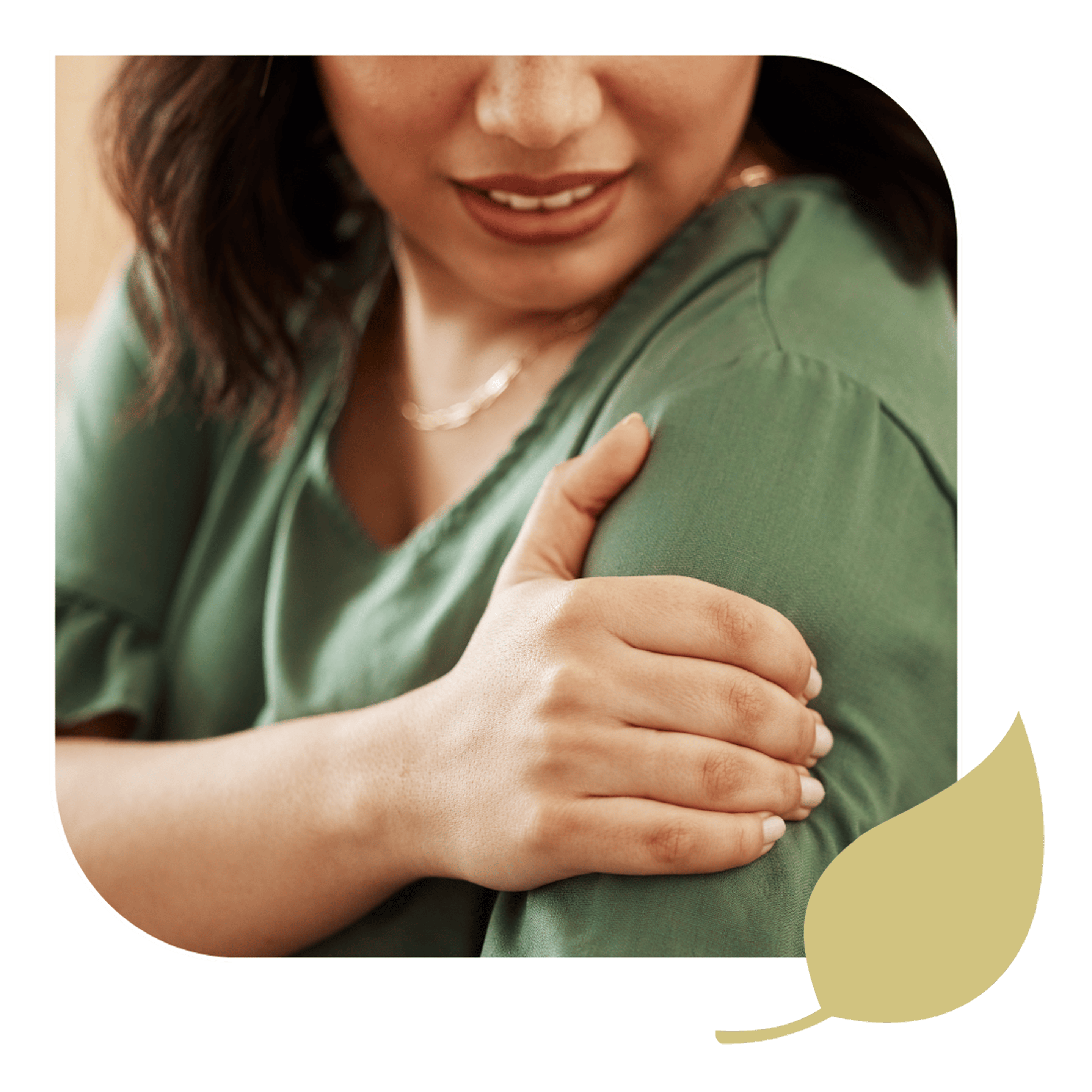 A woman holding her aching shoulder, seeking effective shoulder pain relief.